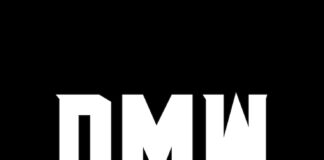 Person working on presentation with multiple screens and notes