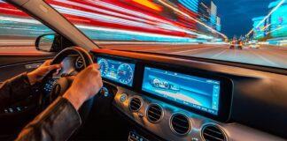 Person accessing corporate banking portal on a laptop with a coffee cup nearby