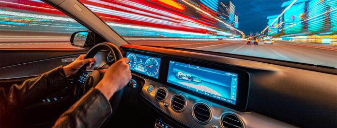 Person accessing corporate banking portal on a laptop with a coffee cup nearby