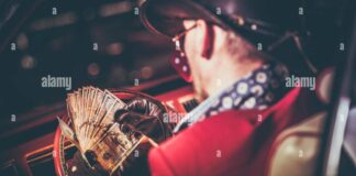 Lucky Casino Winner with His Cash Jackpot in Hands. American Cowboy and ...
