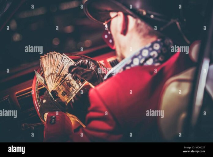 lucky-casino-winner-with-his-cash-jackpot-in-hands-american-cowboy-and-the-classic-car-las-vegas-trip-MD4G2T Lucky Casino Winner with His Cash Jackpot in Hands. American Cowboy and ...